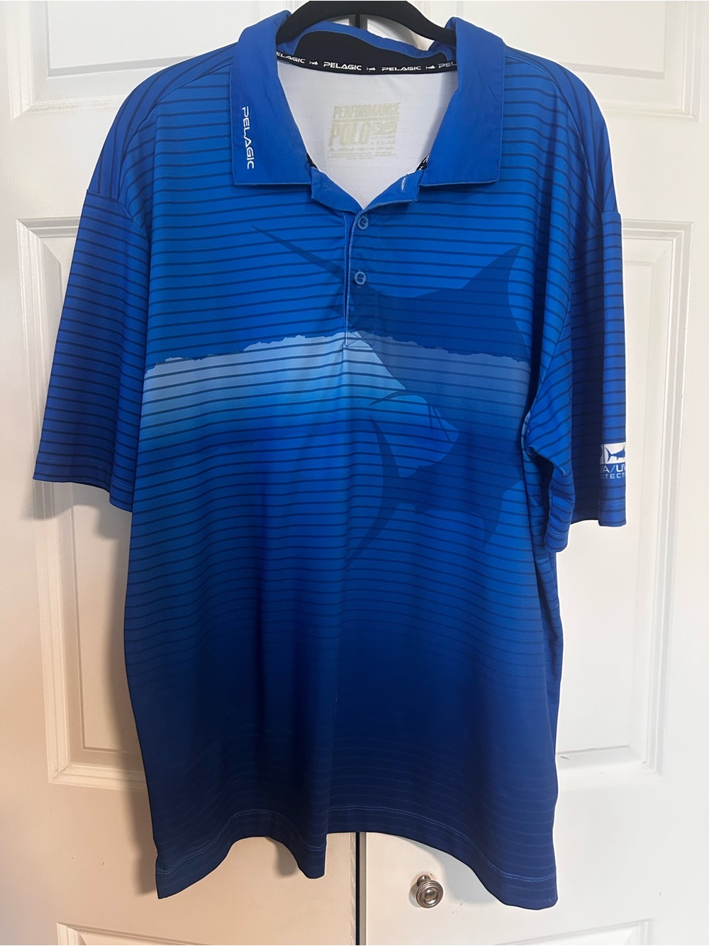 Pelagic Men’s Deep Blue Gradient Polo with Subtle Stripe